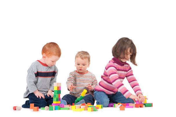 Preschoolers playing with wooden blocks - Photo, Image