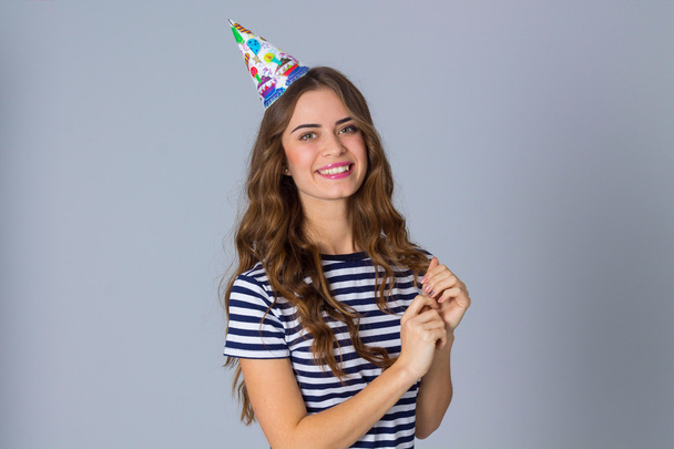 Smiling woman in celebration cap - Photo, Image