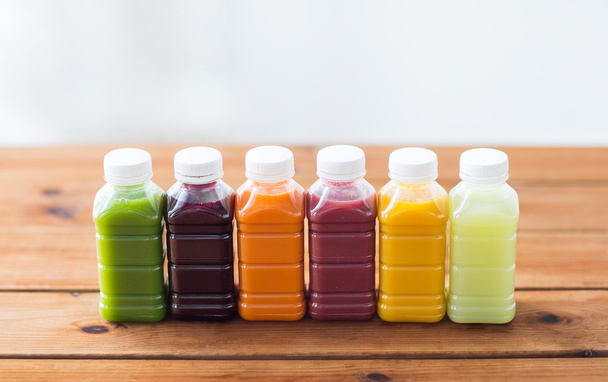 bottles with different fruit or vegetable juices - Photo, Image