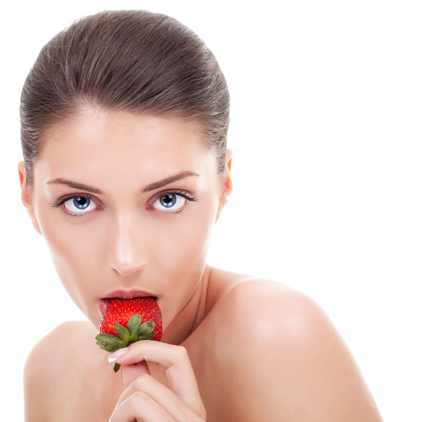 young woman eating strawberry - Φωτογραφία, εικόνα