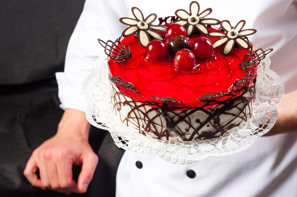 Confectioner and a cake - Foto, afbeelding