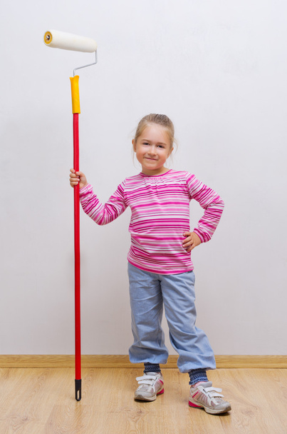 Girl with painting roller - Foto, imagen