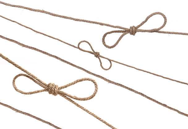 Ropes with knot and bowknot, isolated on white. - Fotó, kép