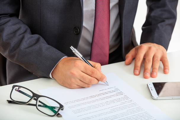 Businessman signing a contract - Photo, Image