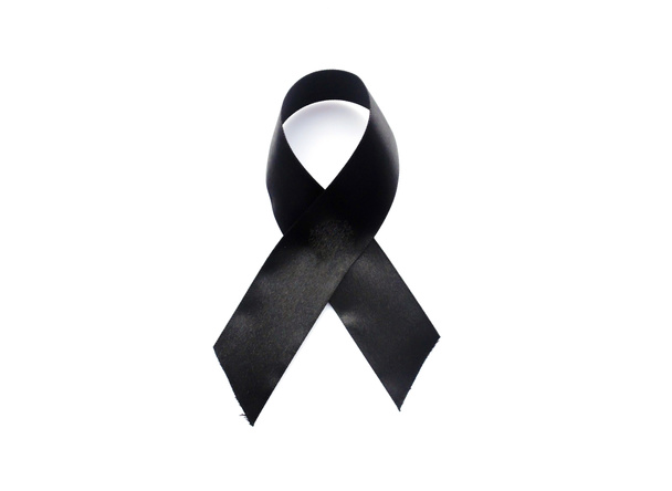 Black awareness ribbon.Mourning and melanoma symbol. Isolated on white - 写真・画像