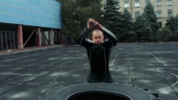 Crossfit exercise jumping on the wheel - Felvétel, videó