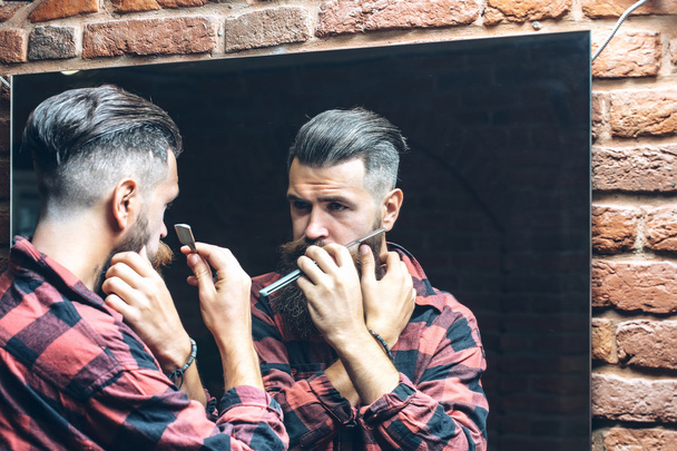 man with razor near mirror - Photo, Image