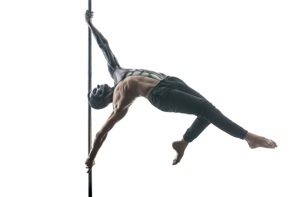 Male pole dancer with body-art on pylon - Fotografie, Obrázek