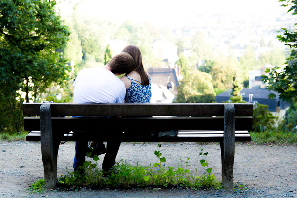 young couple in love, flirting on a bench - Photo, Image