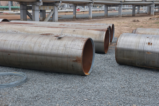 Large diameter pipes lying on the gravel on the spot welding - Photo, Image