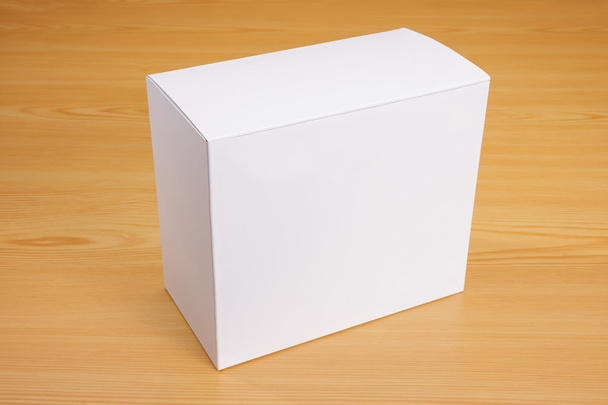 Blank white box mock up on wood background - Photo, Image