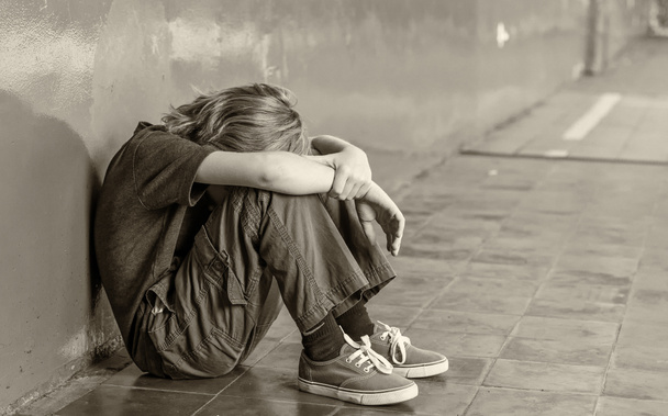 Bullying concept. Isolated sad boy at school - Φωτογραφία, εικόνα