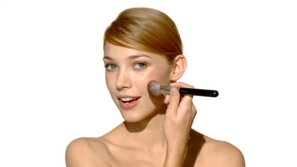 Portrait of beautiful and sexy woman is doing makeup - Záběry, video