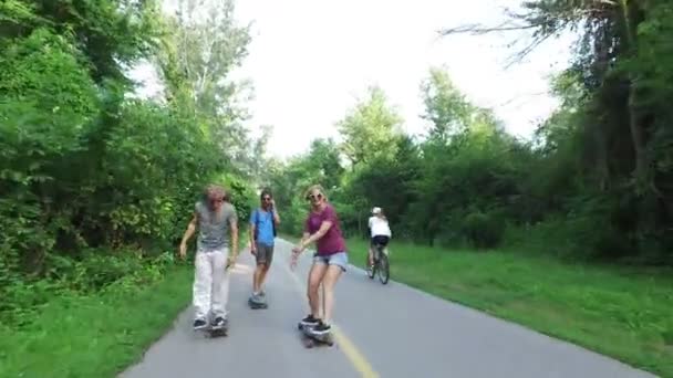  cheerful friends skateboarding - Imágenes, Vídeo