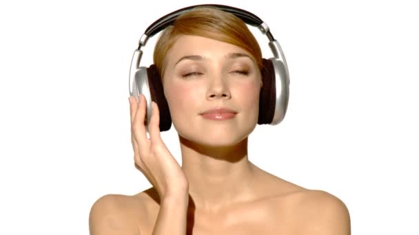 Sexy woman listen to music in headphones - Footage, Video