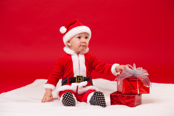 Beautiful little baby celebrates Christmas. New Years holidays. - Photo, Image