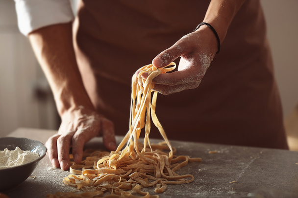 Man preparing pasta  - 写真・画像