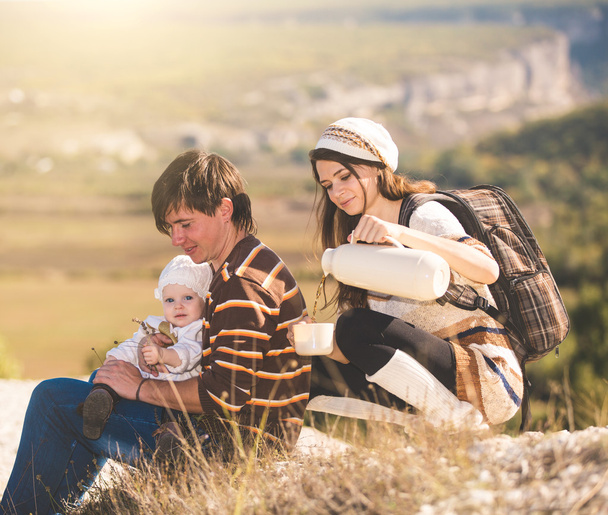Young parents with kid on the mountains - Foto, immagini