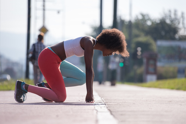 young african american woman stretching  - Fotoğraf, Görsel