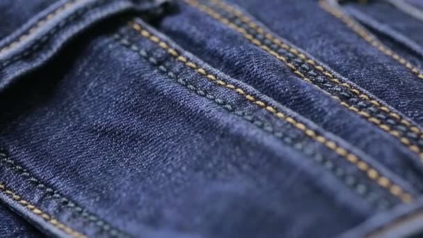 Blue jeans texture. can use as background. close-up of denim - Filmagem, Vídeo