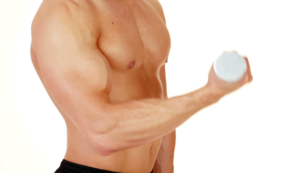 Muscular man exercising with dumbbells on white background - Metraje, vídeo