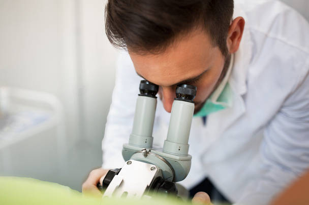 Gynecologist examining a patient with a colposcope - Zdjęcie, obraz