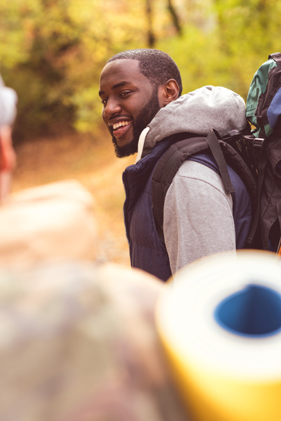 Young smiling man backpacker  - 写真・画像