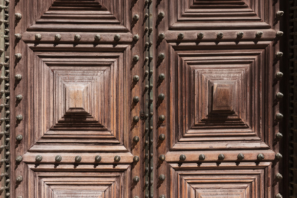 Detail of an ornate wooden door - Фото, изображение