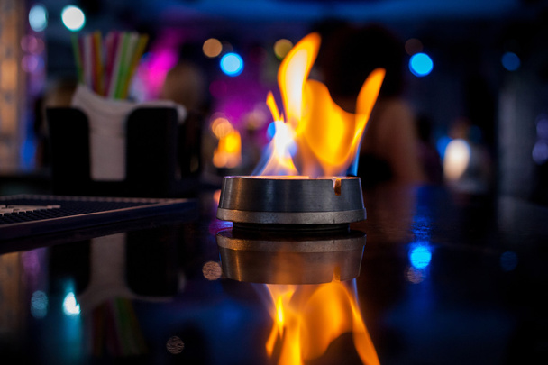 Fire. Flame. The fire on the bar. The bar counter. Fire show - Photo, Image