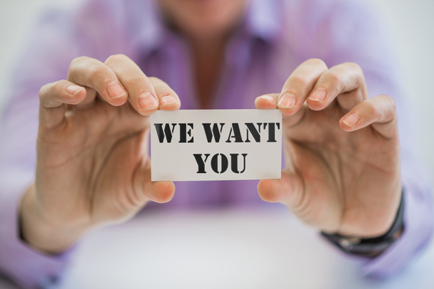 WE WANT YOU! message on the card shown by a businessman - Photo, Image
