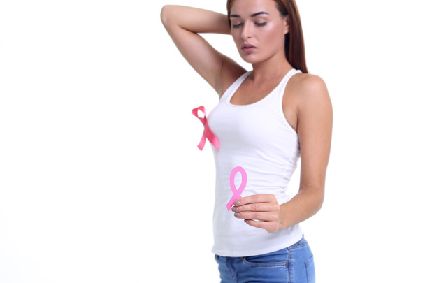 womans hand holding pink breast cancer awareness ribbon - Foto, afbeelding