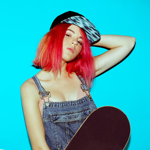 Pretty Teenager girl with pink hair and skateboard Urban Style J - Фото, изображение