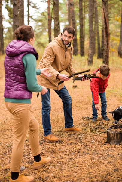 Happy family collecting firewood - Photo, Image