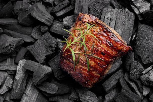 Beef steak on the charcoal. product photo, place for your advertisment - Photo, image