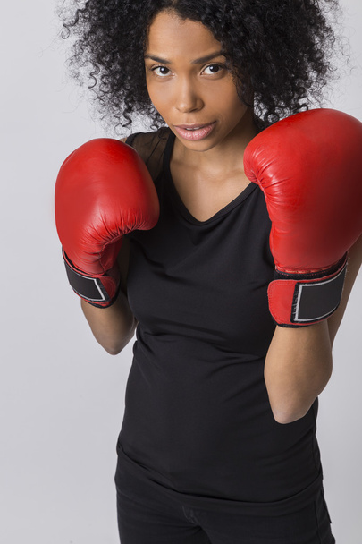 Cute African girl boxer in protection pose - Foto, Imagen