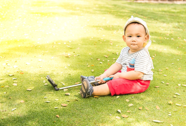 Asian baby taking selfie photo on the green grass field in the p - Photo, Image