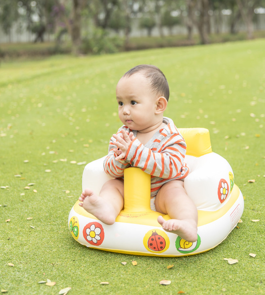 baby sitting in the park, when family taking outdoor picnic.He a - Photo, image