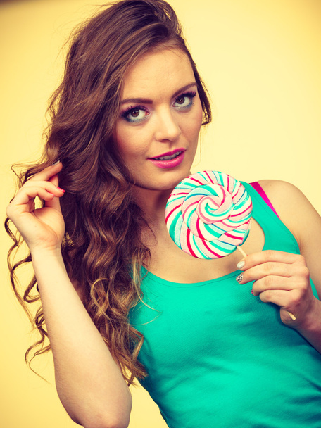 Woman charming girl with lollipop candy - Fotoğraf, Görsel