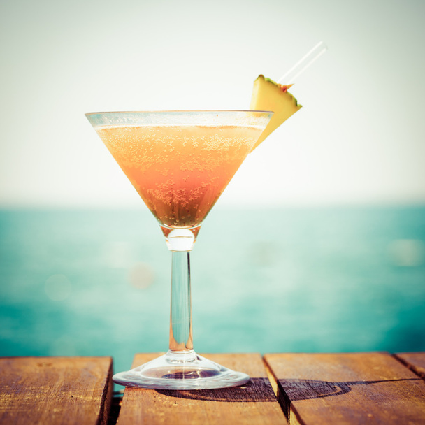 Concept of tropical vacation. Exotic cocktail on the pier. Luxur - Φωτογραφία, εικόνα