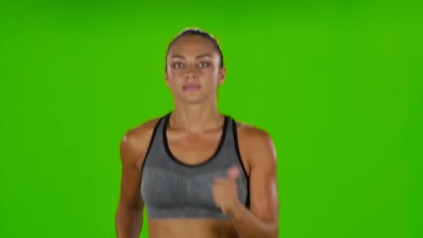 Female runner. Front view. Green screen - Felvétel, videó