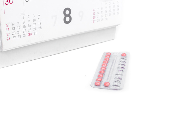 クローズ アップ カレンダー背景、ヘルスケアおよび医学の概念の日付と避妊薬 - 写真・画像