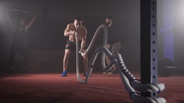 Young athlete doing exercise with rope. - Materiaali, video