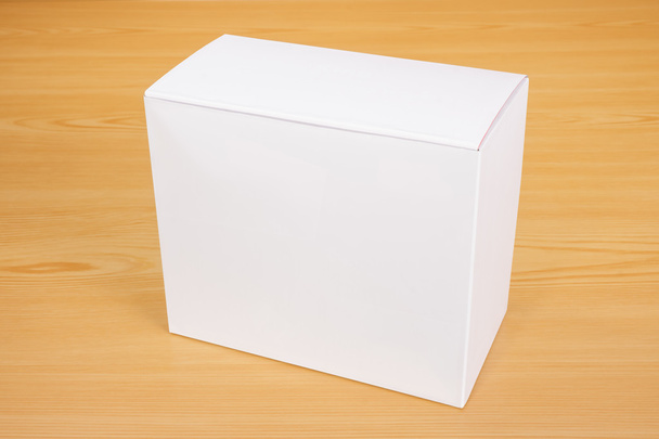 Üres fehér doboz modell, akár a fa háttér - Fotó, kép