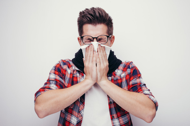 Attractive young man got a cold. All isolated on white background. - 写真・画像
