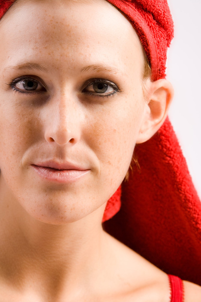 Beautiful wellness girl with red towel on her head - Fotó, kép