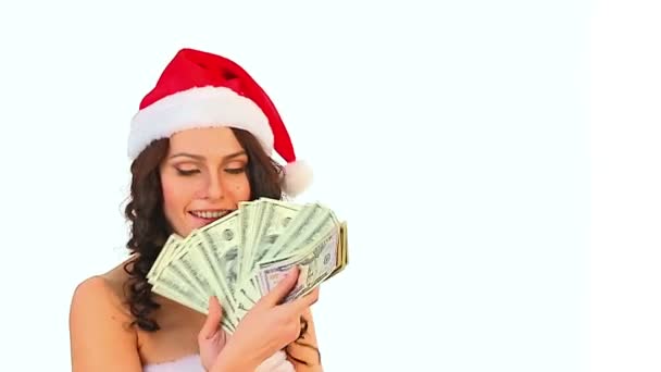 Woman in Santa hat keeps money dollar. - Πλάνα, βίντεο