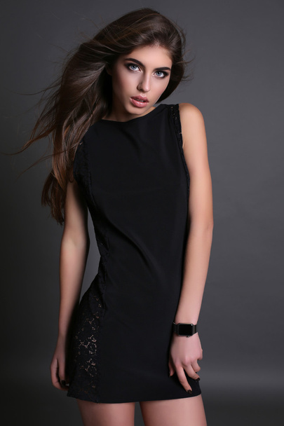 beautiful girl with dark hair and bright makeup in elegant dress  - Valokuva, kuva