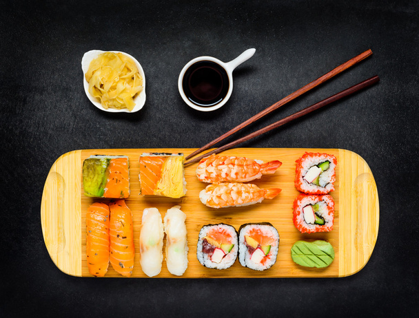 Japanese Cuisine Food with Sushi, Soy Sauce and Tsukemono - Photo, Image