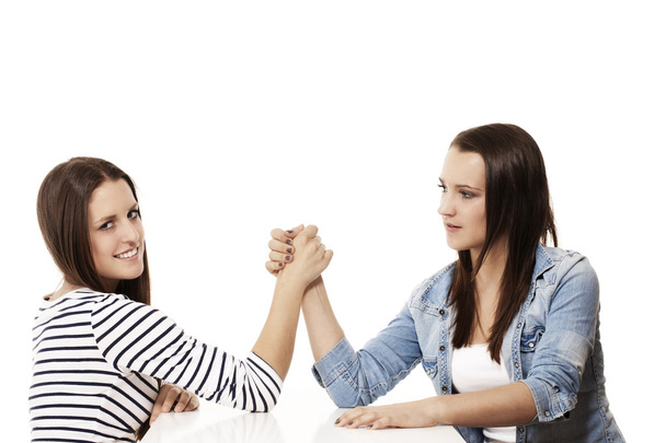 Two arm wrestling teenagers - Фото, изображение