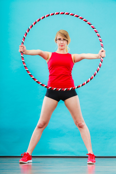 Fit woman with hula hoop doing exercise - Foto, Bild